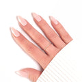 Manucure Press-on Nails Pêche Douce — forme amande longueur moyenne, gros plan teinte lumineuse LYLY Nails